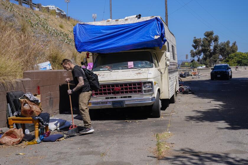 San Diego, CA - June 29: On Wednesday, June 29, 2022 in San Diego, CA., Jeremy Grinager was among the group living out of their cars, RVs and tents on Anna Avenue when they issued vehicle violation warning notices and informed by SDPD that a work crew would be coming through to gather and discard items left behind. Grinager has been living on the streets for the 7-years and is considering relocating to the safe parking lot in Mission Valley. (Nelvin C. Cepeda / The San Diego Union-Tribune)