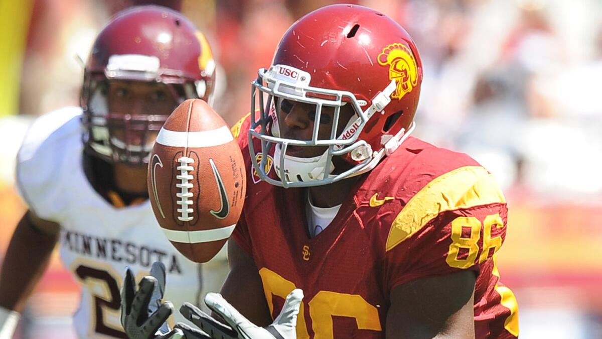 USC tight end Xavier Grimble can't come up with a catch during a win over Minnesota in September 2011.