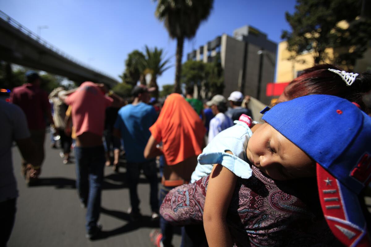 A group of Central American migrants march to the office of the U.N.'s humans rights body in Mexico City on Nov. 8.