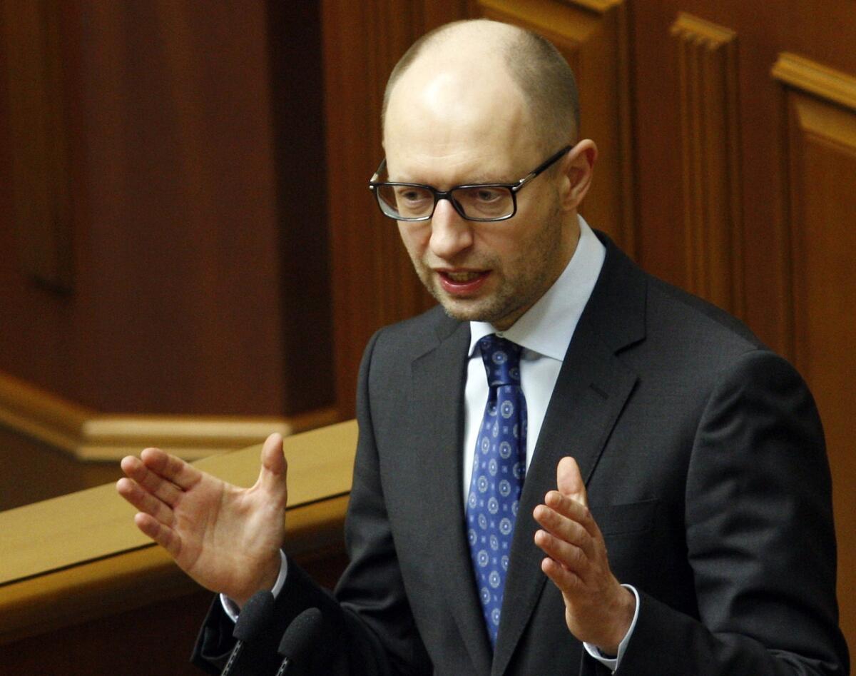 Ukraine's interim prime minister, Arseny Yatsenyuk, gives a speech at the Ukrainian Parliament in Kiev