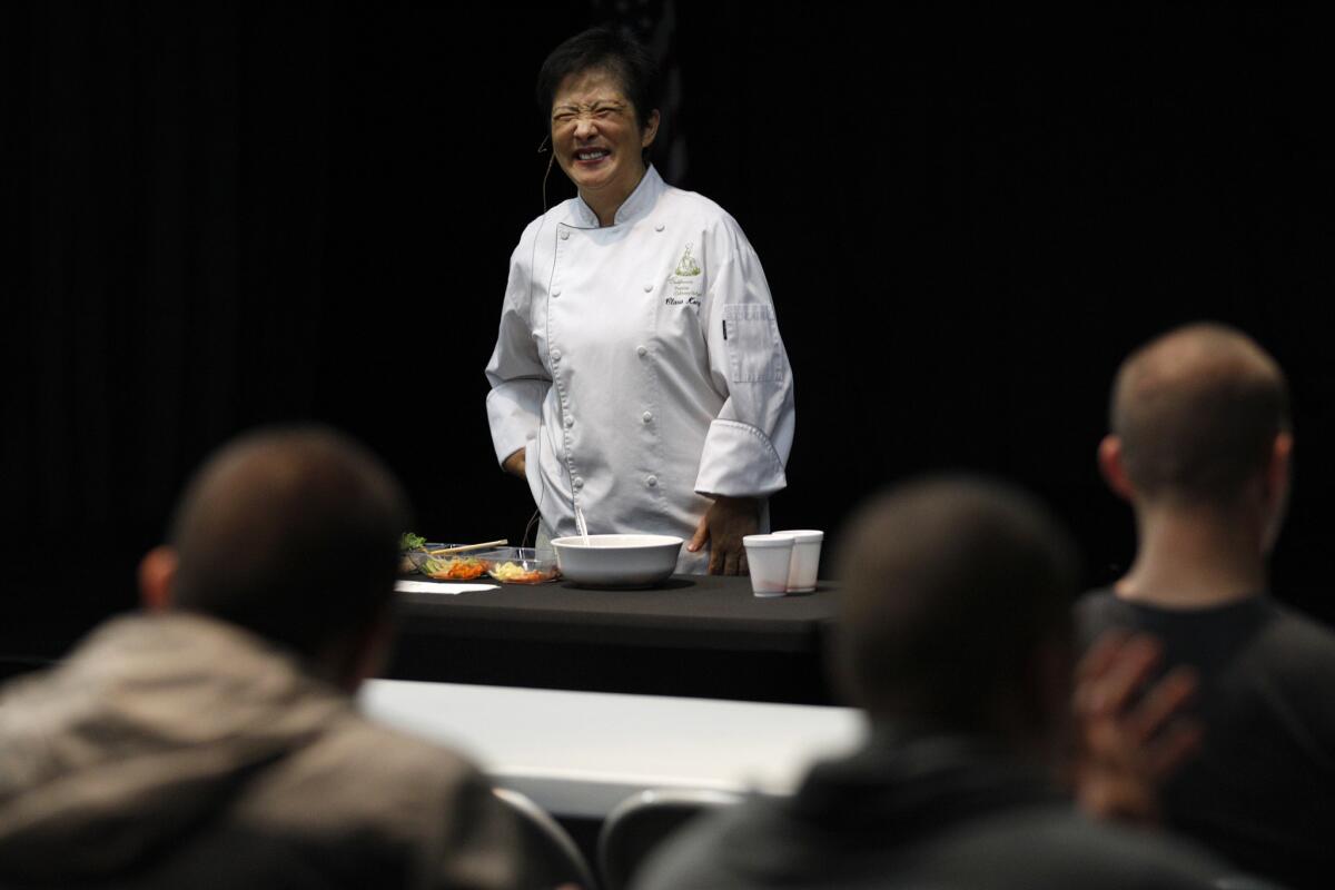 Chef Clara Kong smiles as she wraps up a brief primer on Korean food for LAPD officers attending a daylong seminar on Korean culture at the Korean Cultural Center.