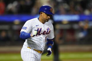 New York Mets' Eduardo Escobar runs the bases after hitting a two-run home run during the ninth inning.