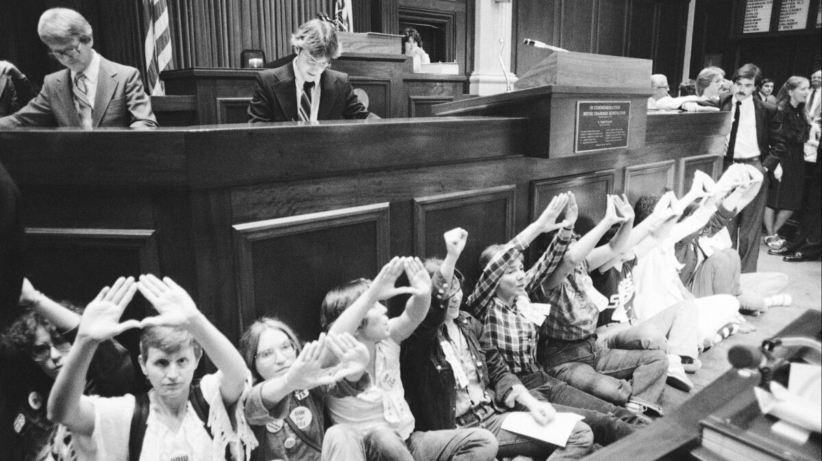 A group of women disrupt the Illinois House in Springfield, Ill. on June 17, 1982. The Illinois Capitol was the scene of high-profile civil disobedience as the clock ticked down on the failed Equal Rights Amendment.