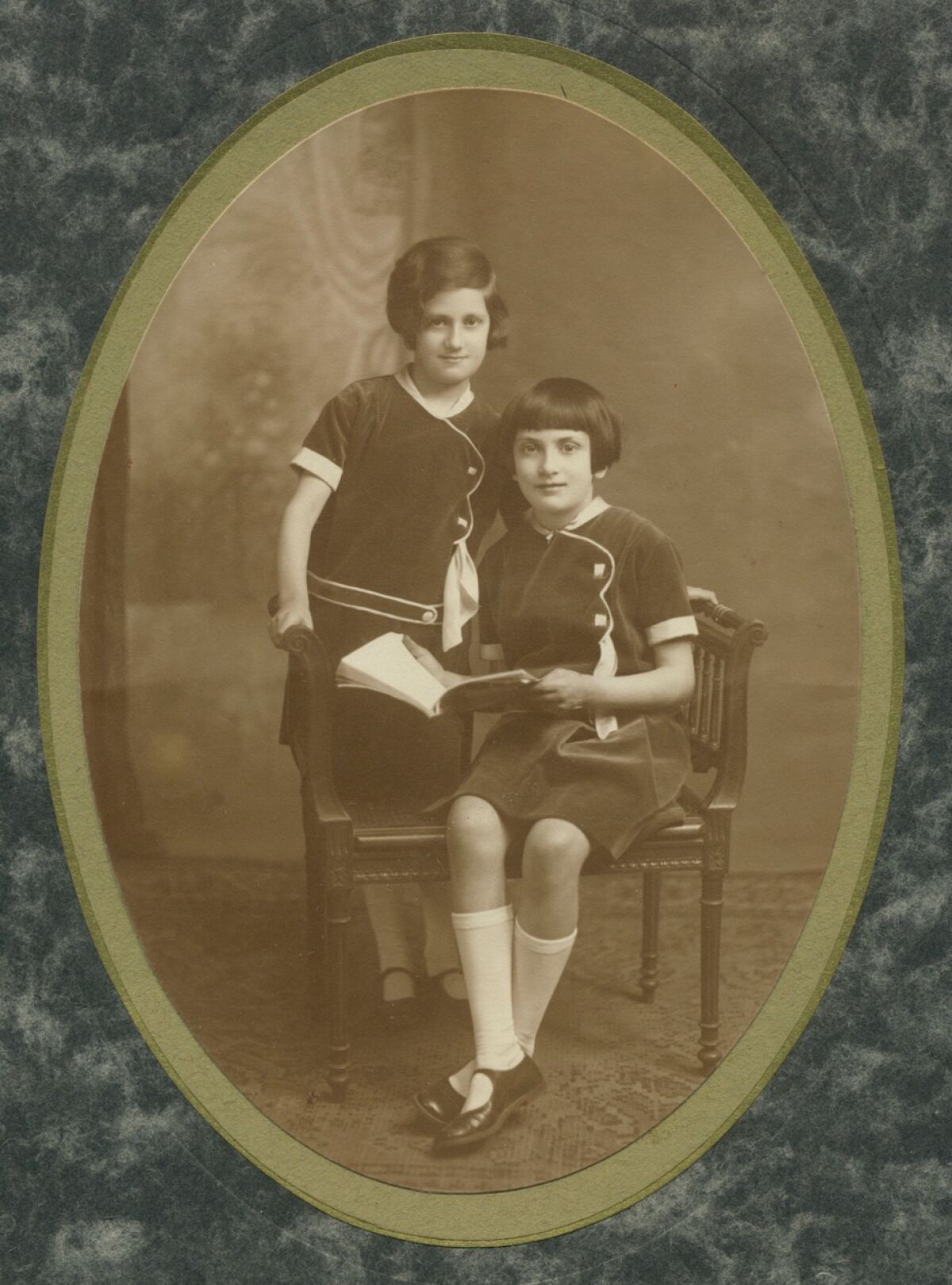 Lucienne Guillemin (left) is pictured with her sister Charlotte in France in 1930.
