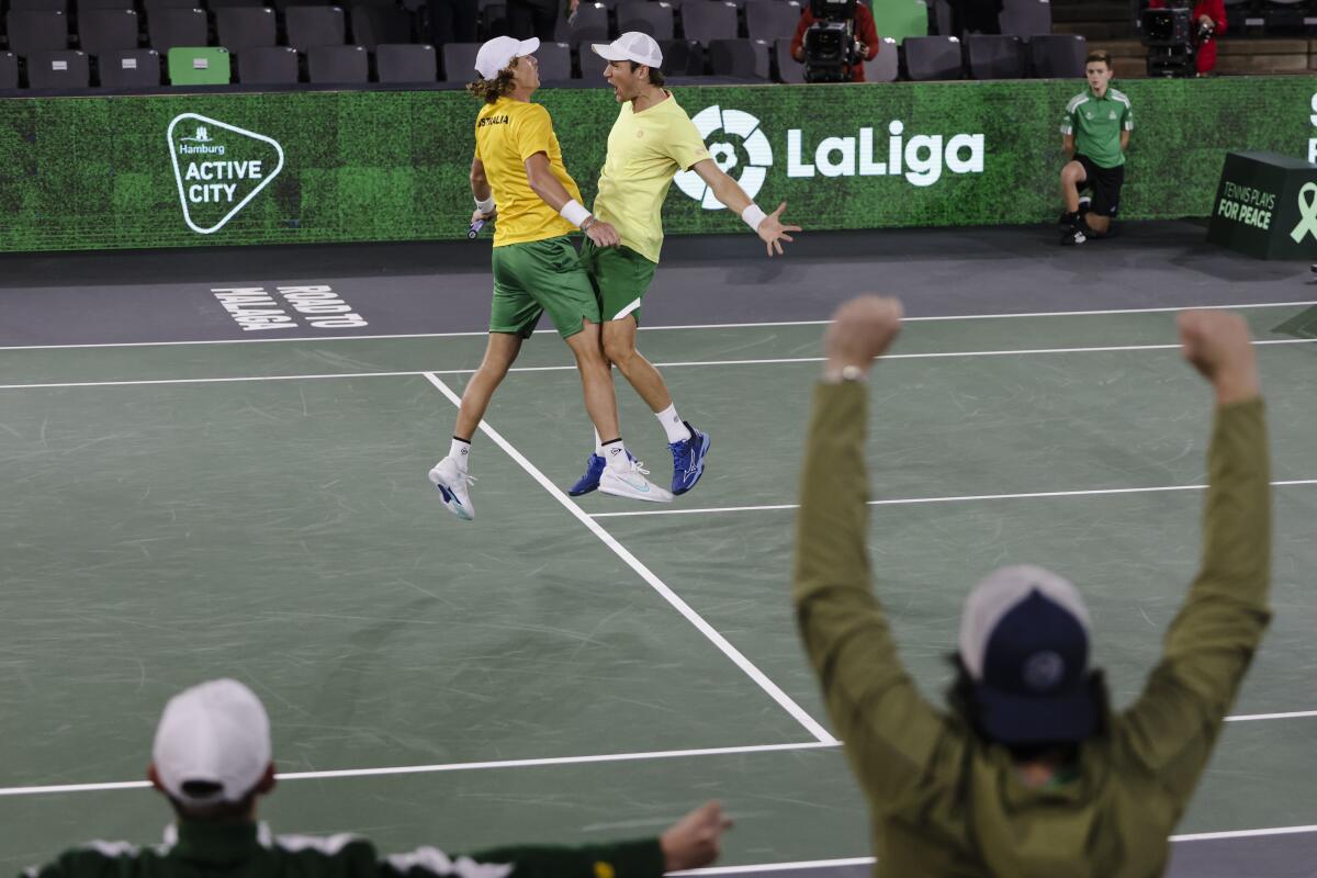Australia's Matthew Ebden, right, and Max Purcell celebrate during the Davis Cup group C tennis match against France's Nicolas Mahut and Arthur Rinderknech, in Hamburg, Germany Thursday, Sept. 15, 2022. (Frank Molter/dpa via AP)