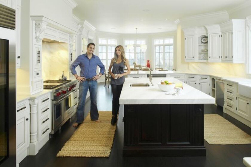 In the kitchen — the epicenter of the house, and Giuliana Rancic's favorite room — a large island is made of honed white Calcutta ducale marble, sanded down to look old and worn. It's typical of what the couple saw during their Italian travels, Bill Rancic said.