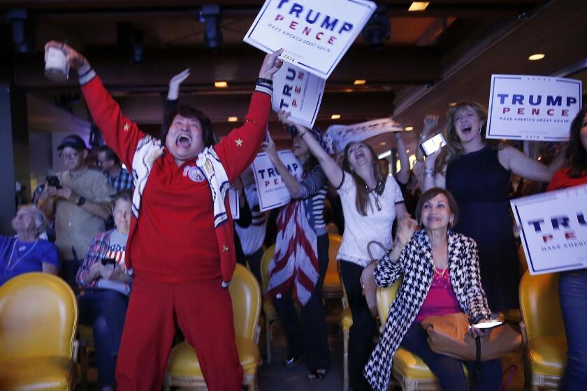 Nellie Gillogly, left, of Santa Ana, and fellow Republicans erupt in celebration as Donald Trump wins Florida. OCGOP election party is at China Palace in Newport Beach.