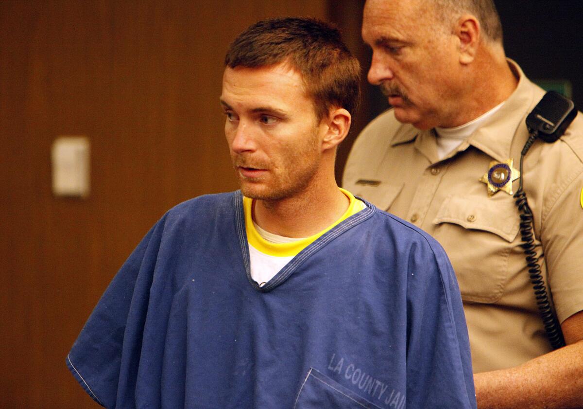 Tobias Dustin Summers, the prime suspect in the kidnapping and sexual assault of a 10-year-old Northridge girl, is led into a courtroom for his arraignment Thursday.