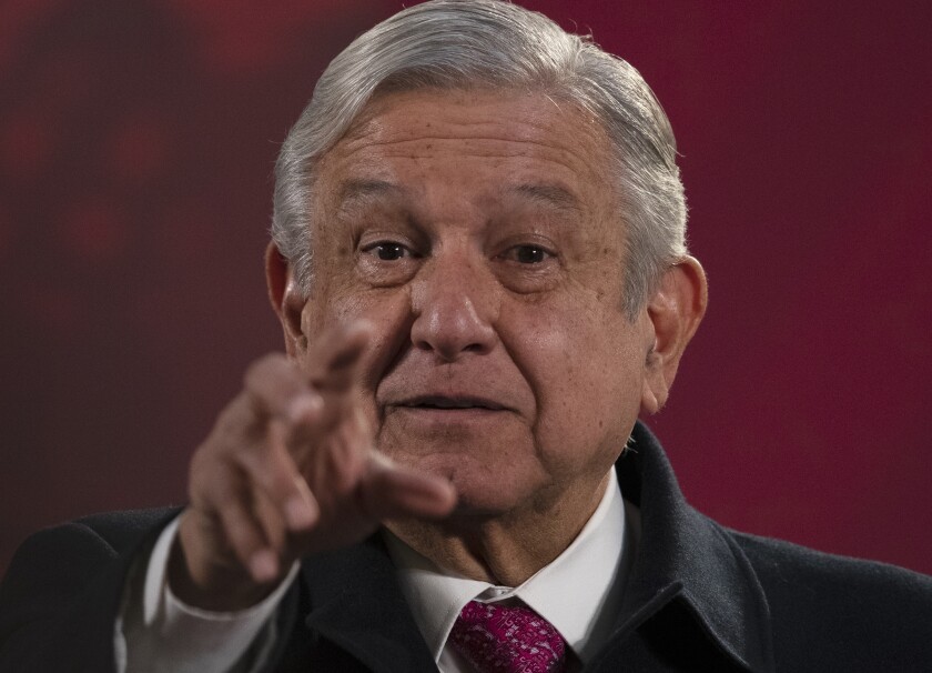 Mexican President Andres Manuel Lopez Obrador gives his regularly scheduled morning press conference known as "La Mañanera" at the National Palace in Mexico City, Friday, Dec. 18, 2020. Las Mañaneras are a platform for the president to relay information he says the media ignore or misrepresent. (AP Photo/Marco Ugarte)