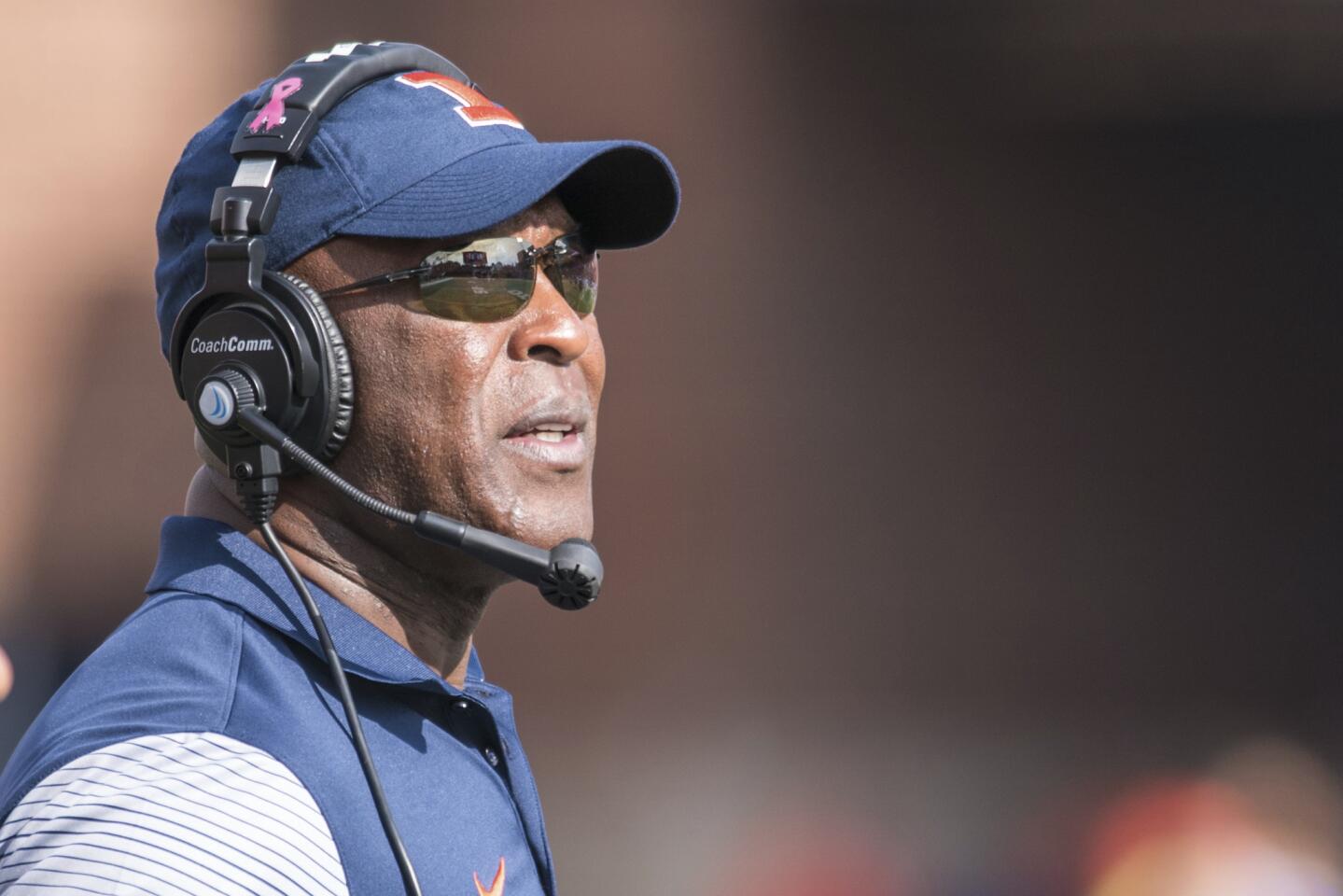 Illinois coach Lovie Smith looks at the scoreboard during the second quarter against Minnesota on Oct. 29, 2016.