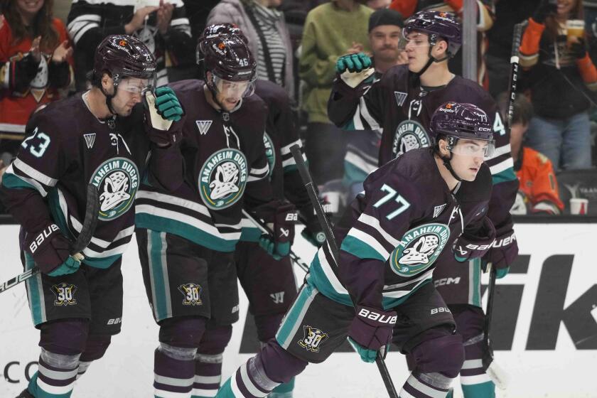 Anaheim Ducks' Frank Vatrano (77) skates toward the bench after celebrating his goal.