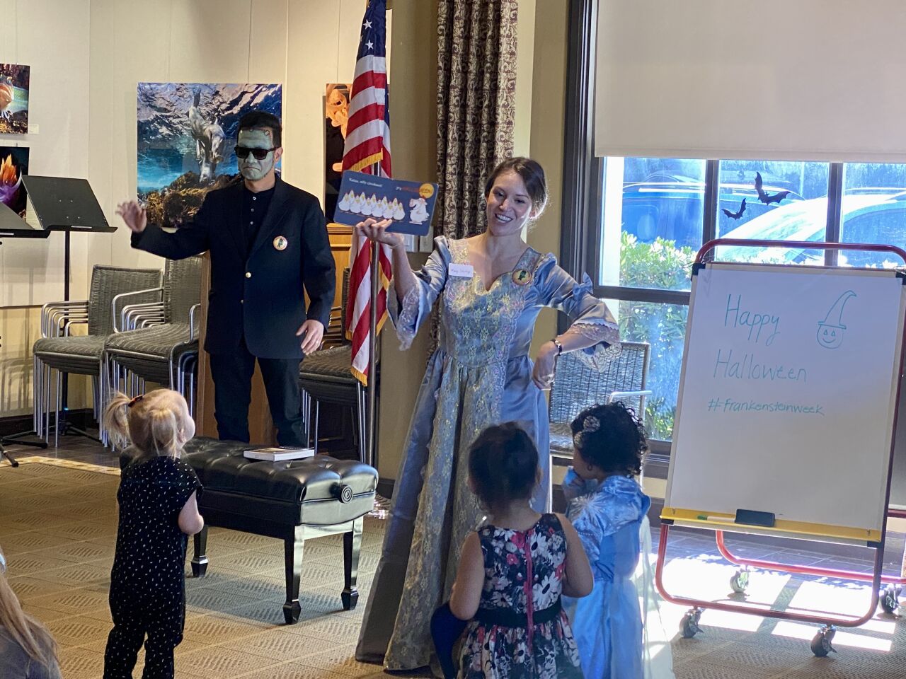 Youth services librarian Katia Graham, as Mary Shelley, leads a Halloween story time with library assistant Dennis Abad as Frankenstein's monster on Oct. 28 at the La Jolla/Riford Library.