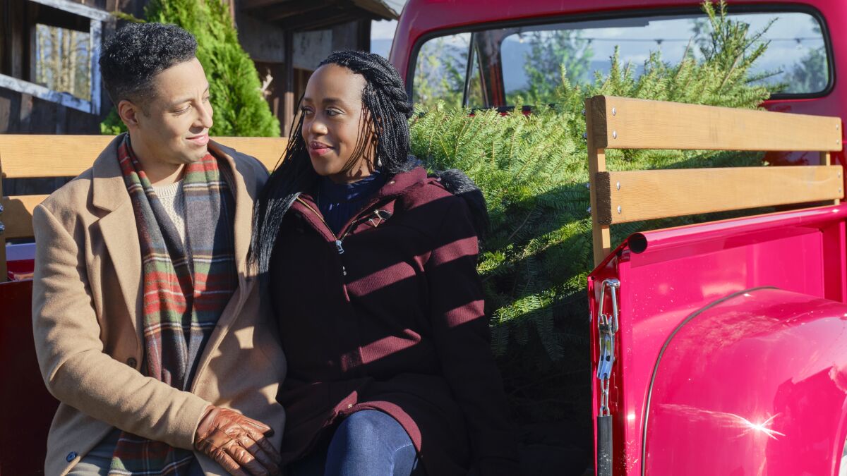 Antonio Cayonne and Rukiya Bernard in "Christmas in Evergreen: Bells Are Ringing" on Hallmark.