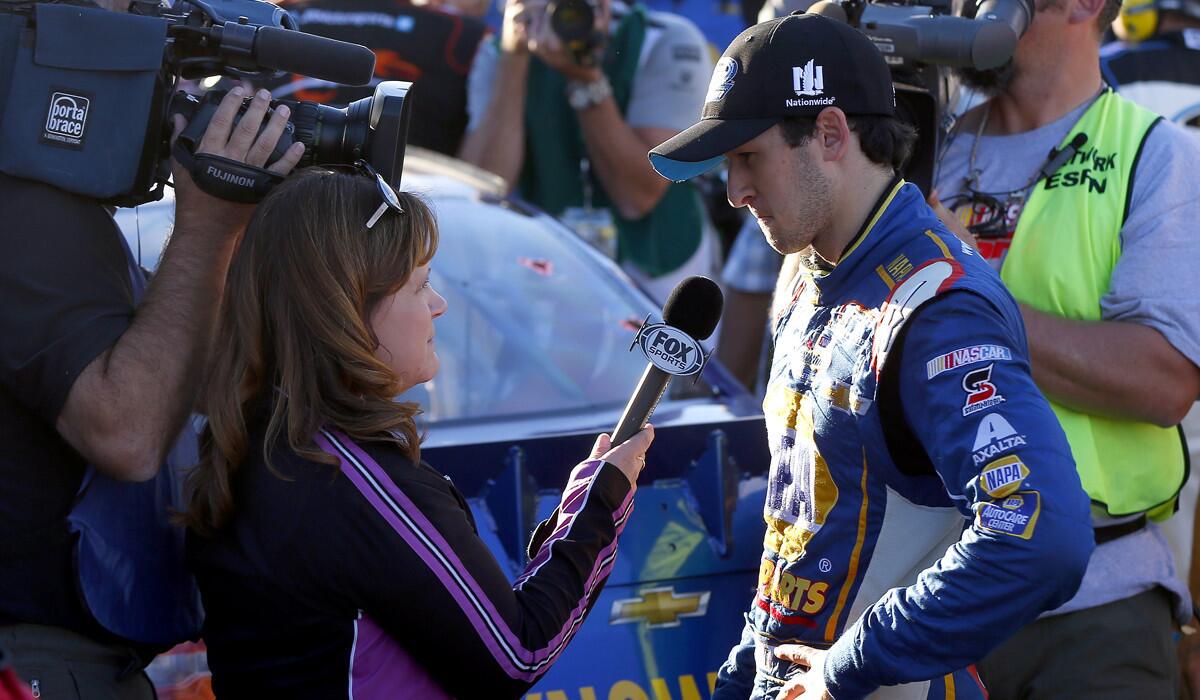 NASCAR driver Chase Elliott is interviewed after clinching the Nationwide Series championship by finishing fifth in the race Saturday at Phoenix International Raceway.