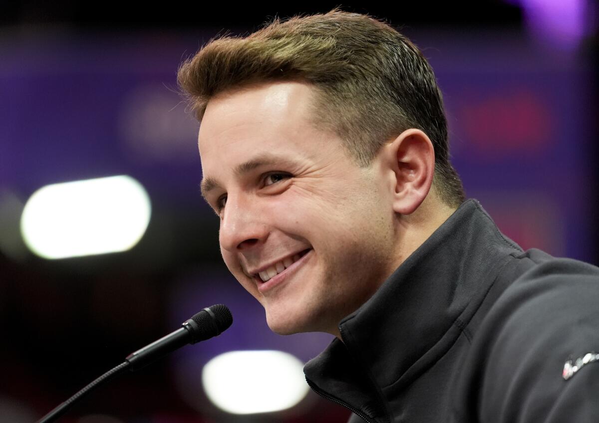 San Francisco 49ers quarterback Brock Purdy smiles while speaking to reporters during Super Bowl Opening Night.