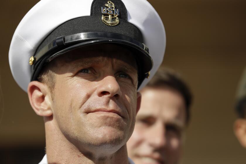 Navy Special Operations Chief Edward Gallagher leaves a military court on Naval Base San Diego, Tuesday, July 2, 2019, in San Diego. A military jury acquitted a decorated Navy SEAL of premeditated murder Tuesday in the killing of a wounded Islamic State captive under his care in Iraq in 2017. (AP Photo/Gregory Bull)