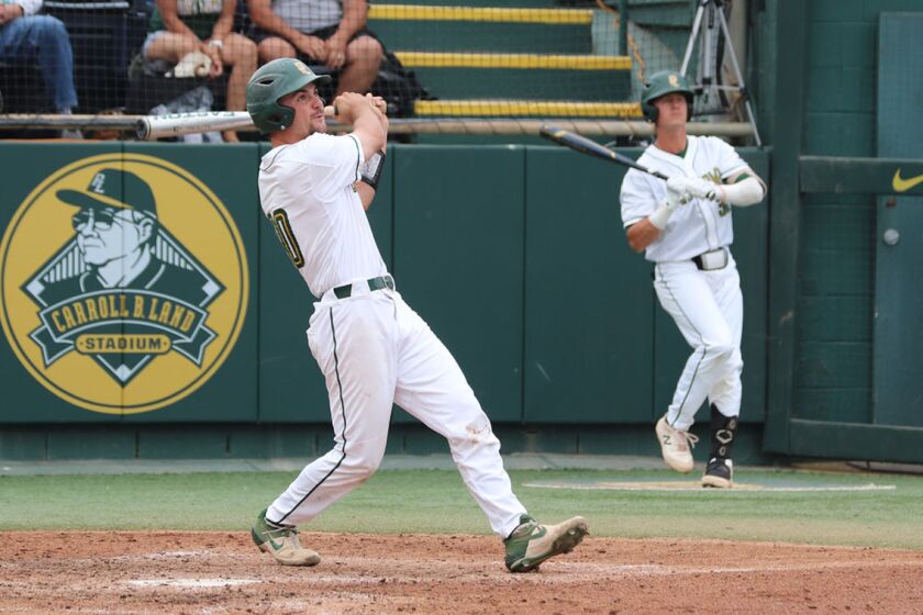 Point Loma Nazarene's Hunter Otjen watches his three-run homer go over the fence in right-center at Carroll B. Land Stadium.