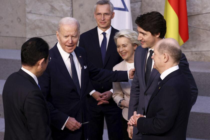 From left, Japan's Prime Minister Fumio Kishida, U.S. President Joe Biden, NATO Secretary General Jens Stoltenberg, European Commission President Ursula von der Leyen, Canada's Prime Minister Justin Trudeau and Germany's Chancellor Olaf Scholz befor the G7 leaders' group photo during a NATO summit in Brussels, Thursday March 24, 2022. (Henry Nicholls/Pool via AP)