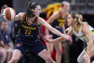 Dallas Wings guard Jacy Sheldon (4) defends Indiana Fever guard Caitlin Clark (22) i