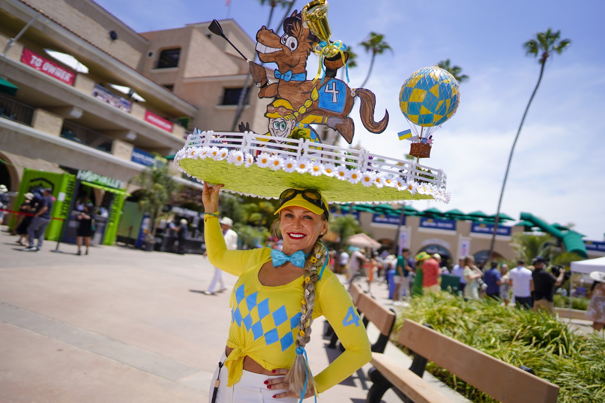 Steffi Poce wears her racing spirit on opening day of the Del Mar thoroughbred horse racing season.