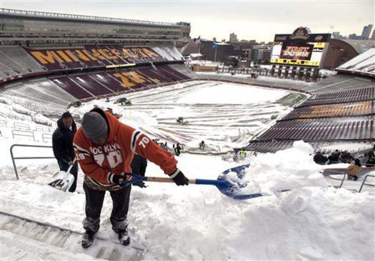 The MetLife Stadium field crew had a busy day shoveling snow at the Packers- Giants game