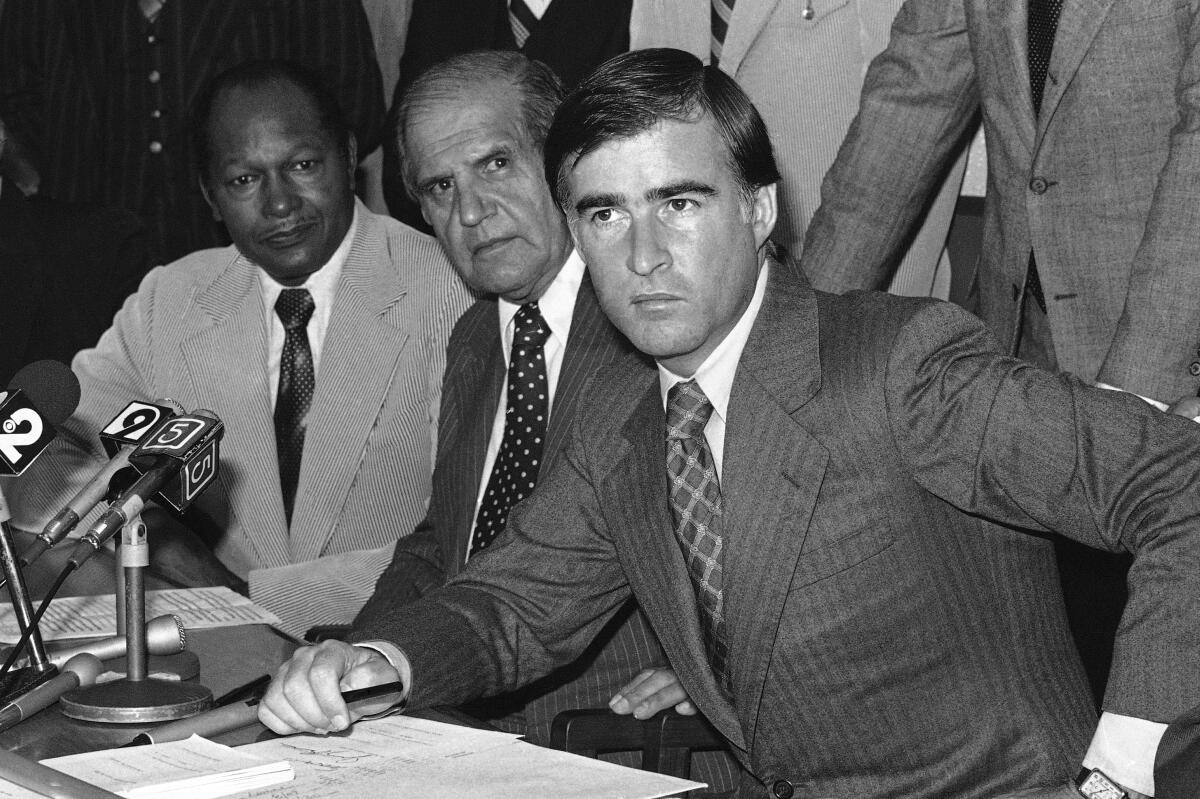 Gov. Jerry Brown with Los Angeles Mayor Tom Bradley, left, and L.A. County Sheriff Peter Pitchess in 1978, signing an anti-crime bill.