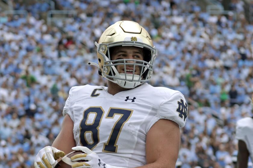 Notre Dame tight end Michael Mayer (87) flashes a smile as he scores a touchdown during the first half of an NCAA college football game against North Carolina in Chapel Hill, N.C., Saturday, Sept. 24, 2022 (AP Photo/Chris Seward)