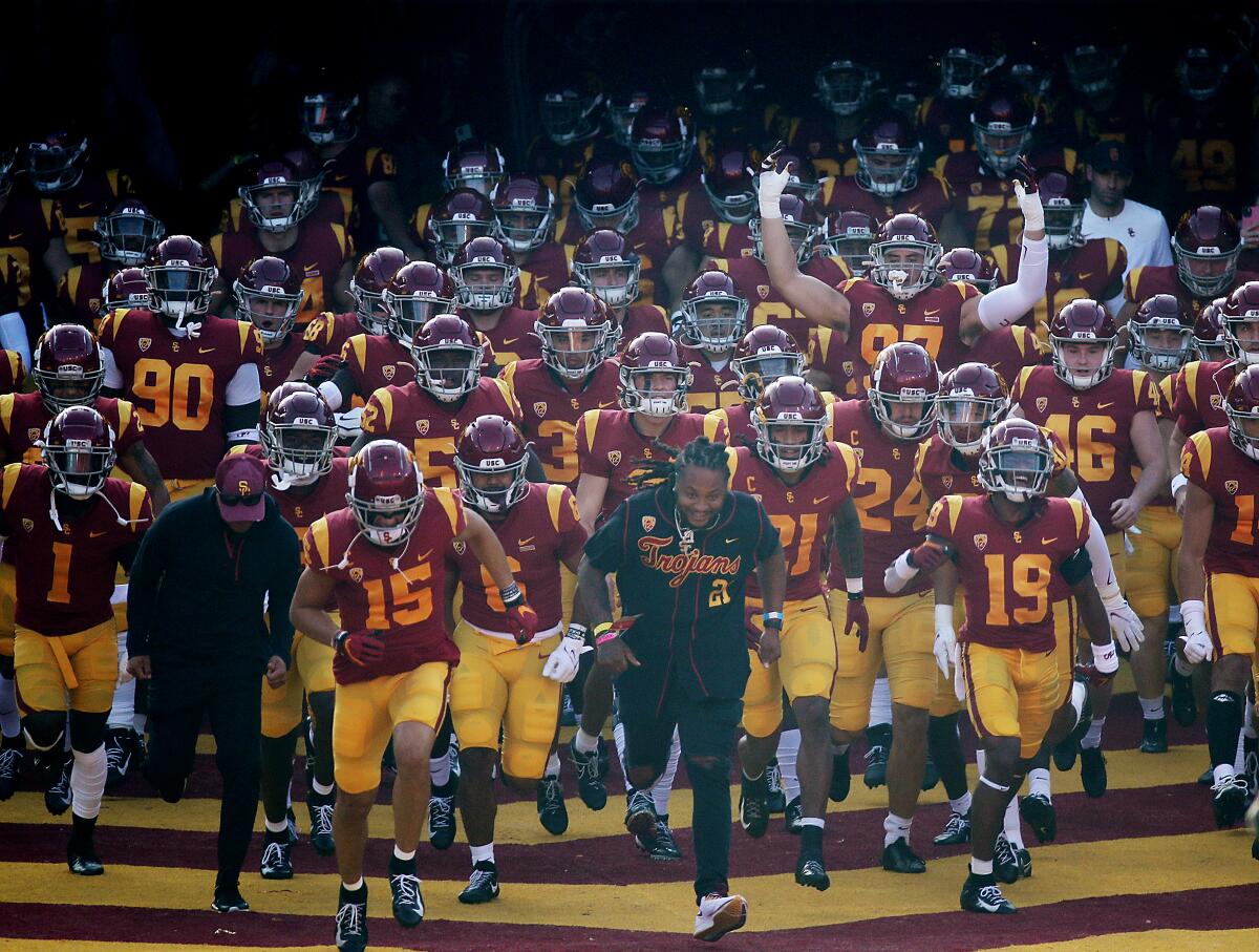 The USC Trojans take the field for a game against Arizona at the Coliseum 