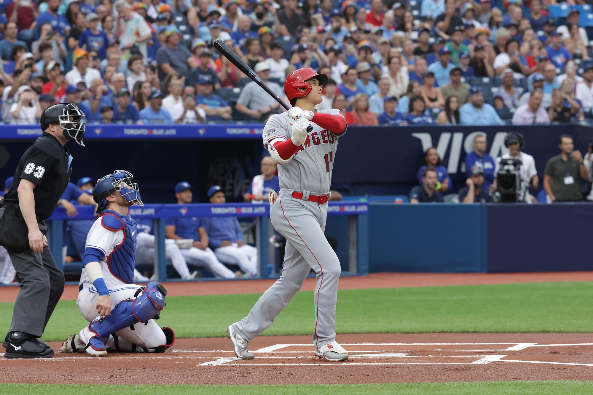 Shohei Ohtani hits a home run for the Angels at Toronto.