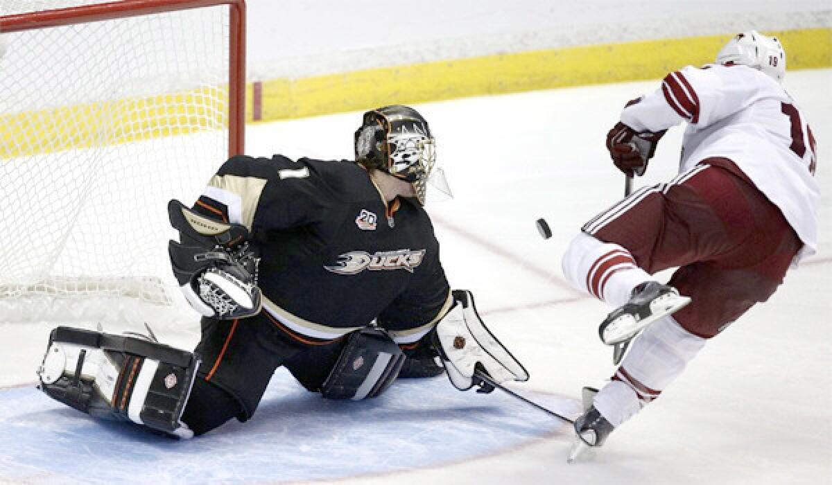Goaltender Jonas Hiller deflects a Shane Doan shot during a shootout during the Ducks' 3-2 shootout victory over the Phoenix Coyotes on Friday.