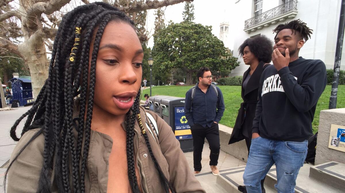 Sociology major Carlisha Washington, 24, returned from a study abroad program to roommates who told her they did not want her using their dishes because of her "germs." Her fellow Black Student Union colleague, Key'Toya Burrell, 23, is on the steps in a black coat.