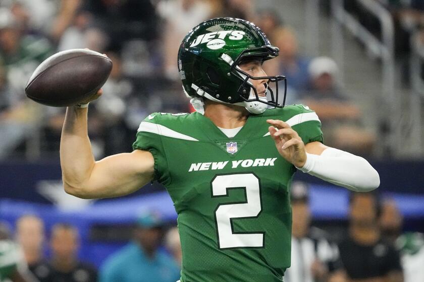 New York Jets quarterback Zach Wilson passes against the Dallas Cowboys during the first half of an NFL football game in Arlington, Texas, Sunday, Aug. 17, 2023. (AP Photo/Sam Hodde)