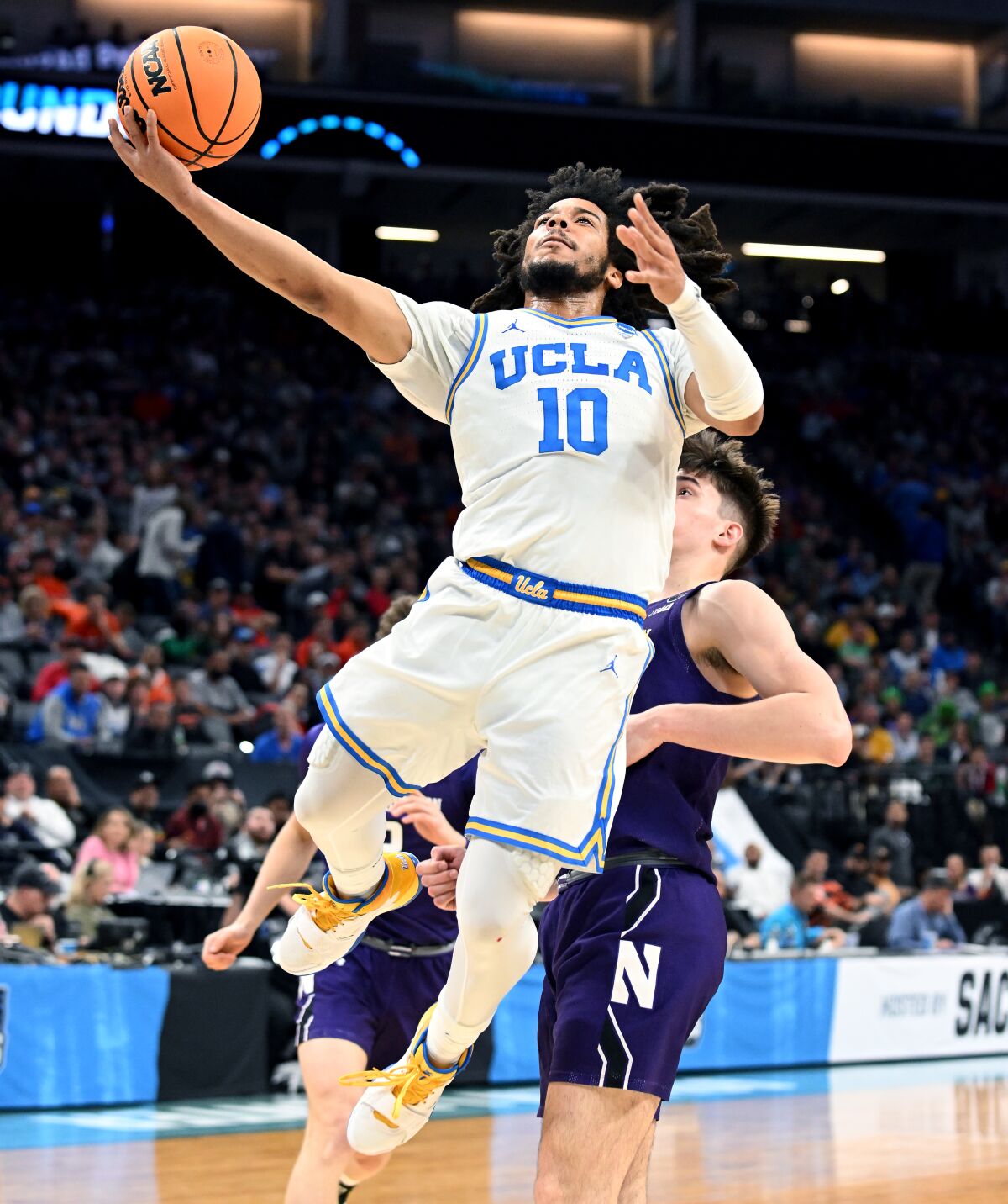 UCLA's Tyger Campbell puts up a shot against Northwestern in the first half Saturday.