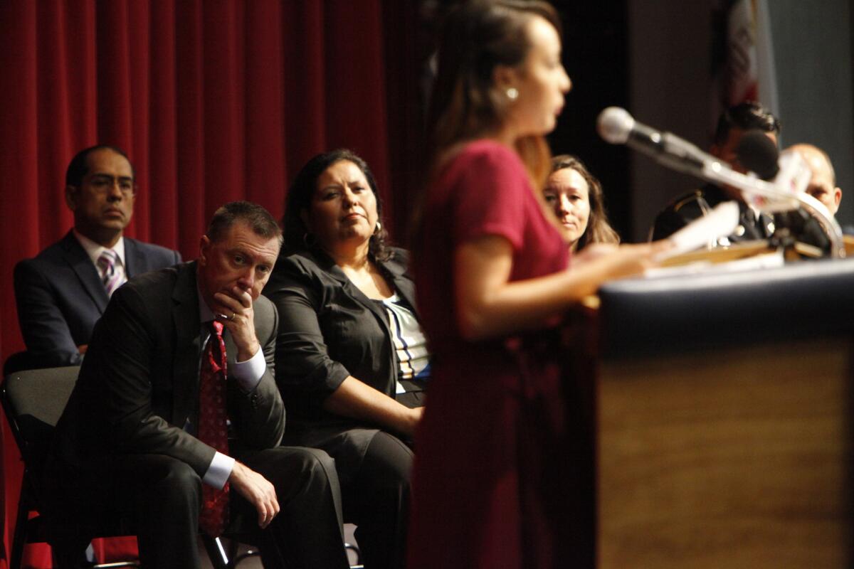 L.A. schools Supt. John Deasy, leaning forward, watches as Vanessa Perez, 18, recounts the hardships she overcame to graduate. He then assigned every administrator a troubled student to see through to graduation.