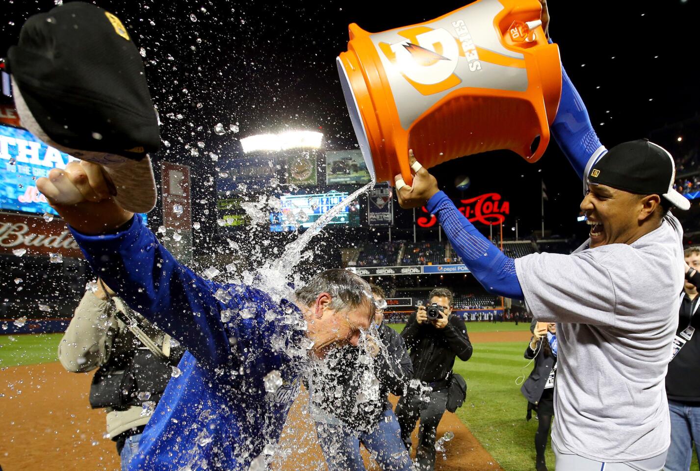 Catcher Salvador Perez douses Manager Ned Yost as the Royals celebrate their World Series title.