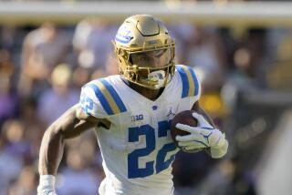 UCLA running back Keegan Jones (22) runs during an NCAA football game against LSU on Saturday, Sept. 21, 2024, in Baton Rouge, La. (AP Photo/Matthew Hinton)