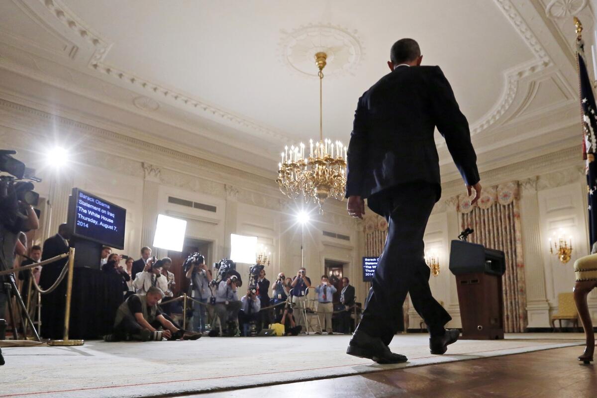 President Obama approaches the lectern to speak about the crisis in Iraq.