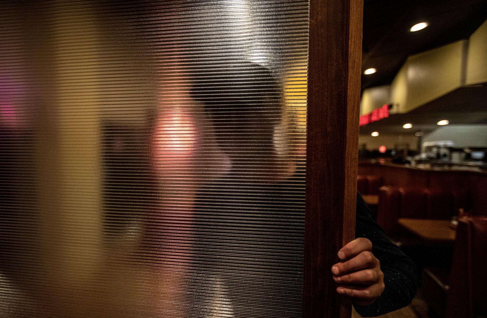 Immigrant cannabis workers like this one
say they endure substandard conditions and
exploitation.