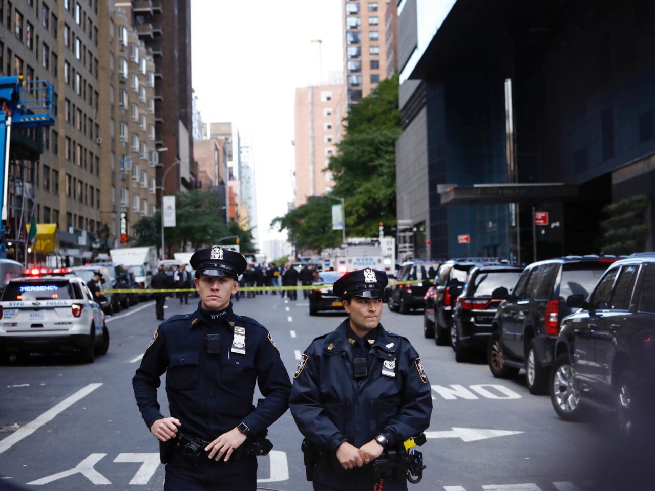Police stand guard in a closed street after a bomb alert at the Time Warner offices in New York. Police were called to a suspicious package sent to the Time Warner building in which CNN is located.