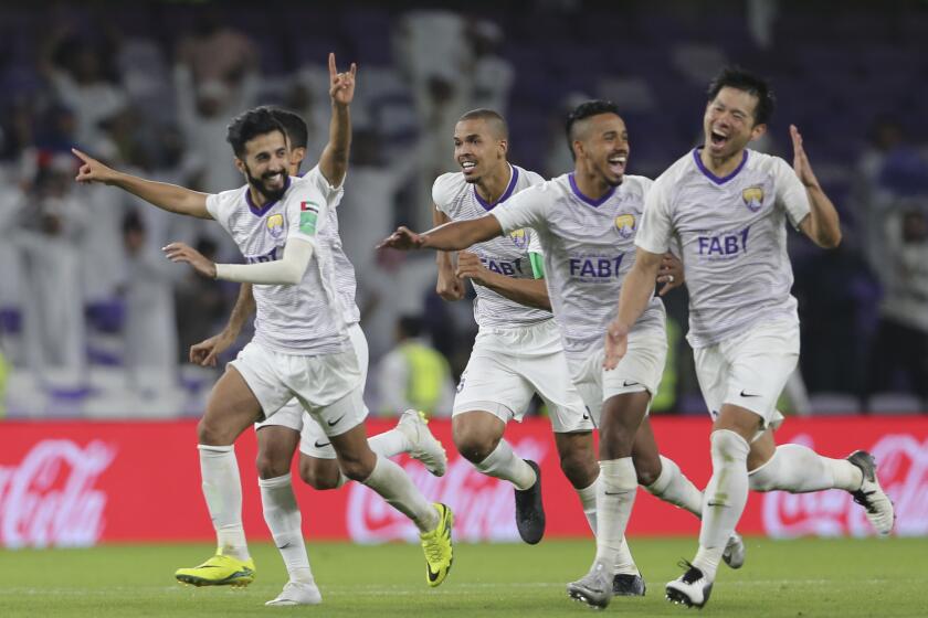 Al Ain players celebrate after winning a penalty shootout during the first round of the Club World Cup soccer match between Al Ain Club and Team Wellington at the Hazza Bin Zayed stadium in Al Ain, United Arab Emirates, Wednesday, Dec. 12, 2018.