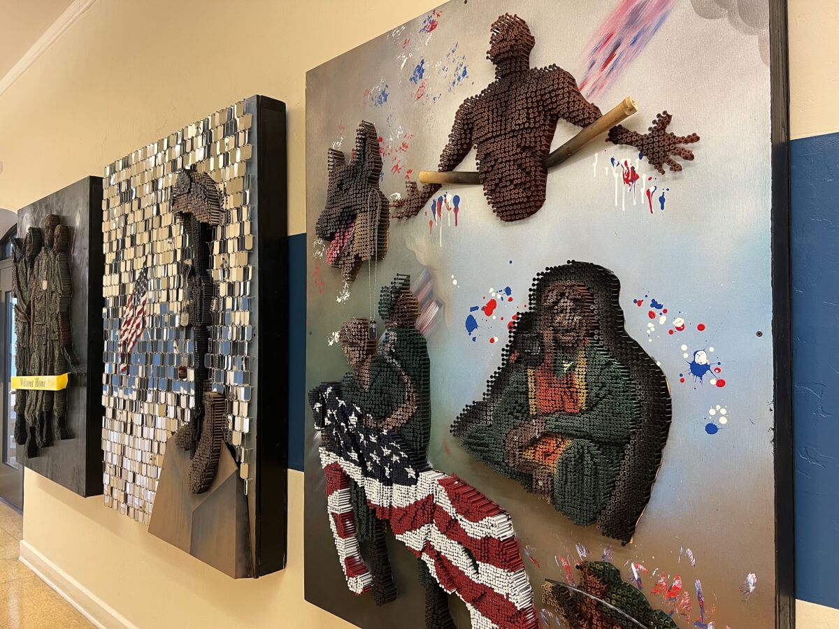 Art panels by Joe Pisano in the "The Art of Immortalizing Heroes" exhibit at Liberty Station.