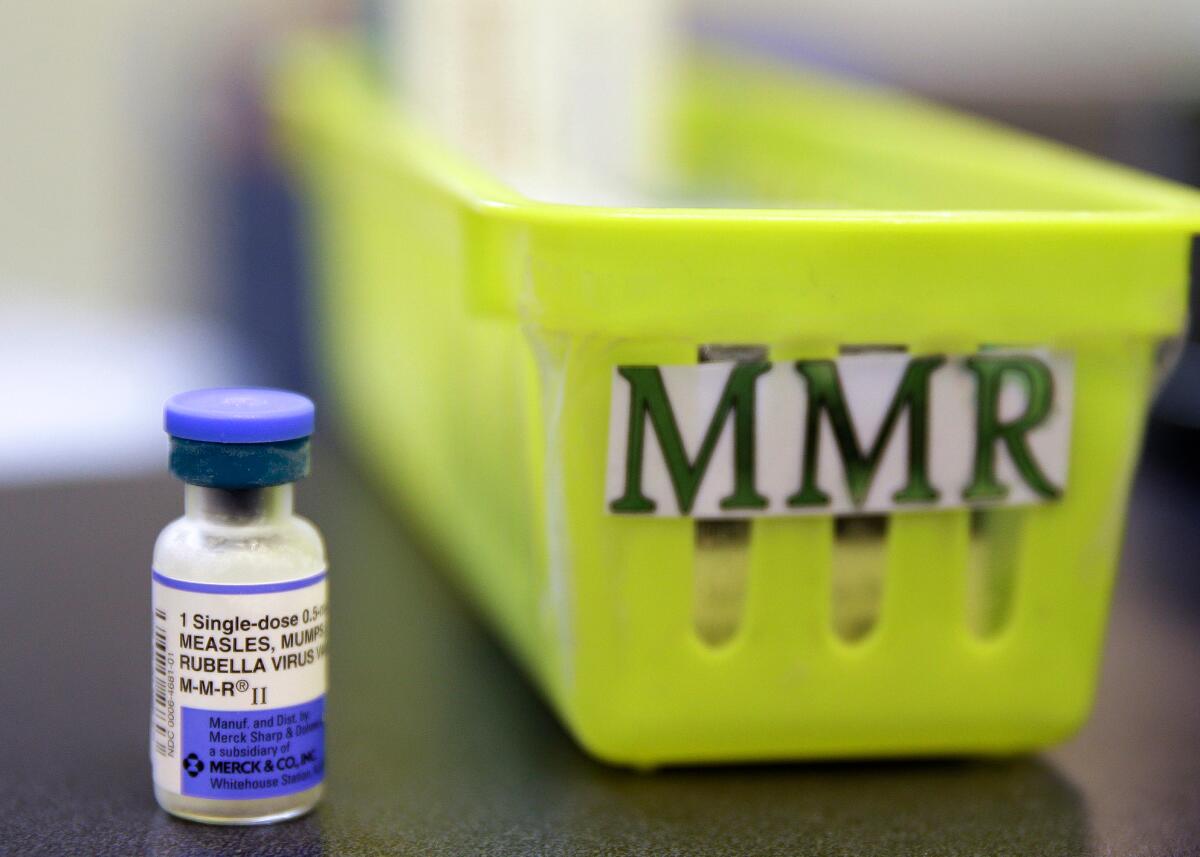 A vaccine against measles, mumps and rubella sits on a countertop.