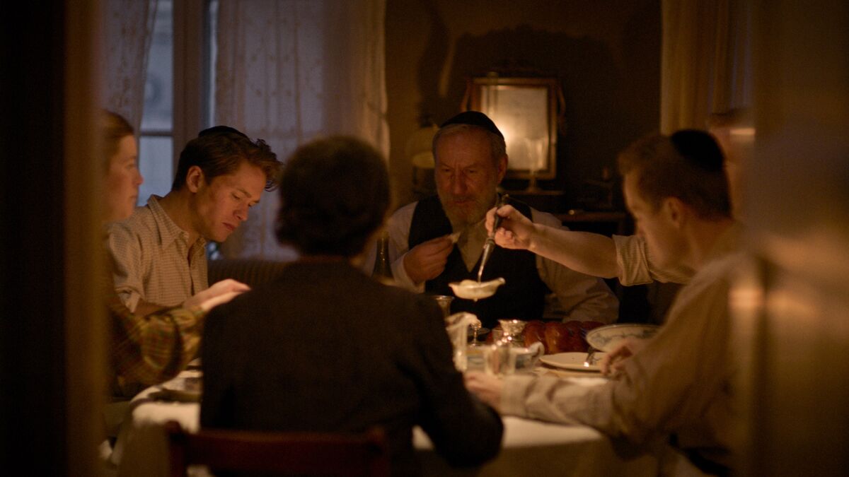 A family sits down to dinner in the movie "Betrayed."