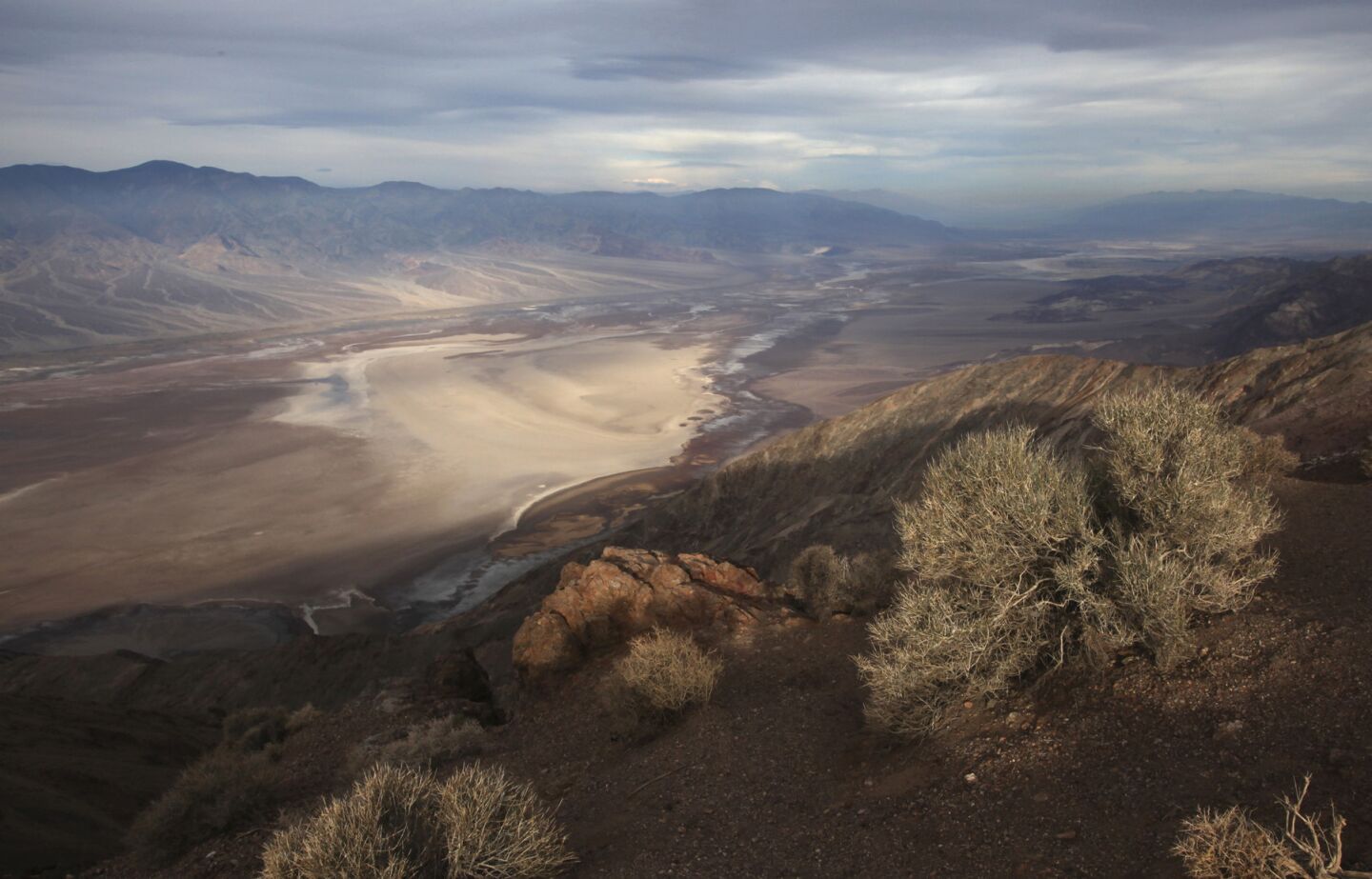 Dante's View offers a wide vista of Death Valley National Park with the Badwater Basin below, rimmed by the Panamint Mountain Range.