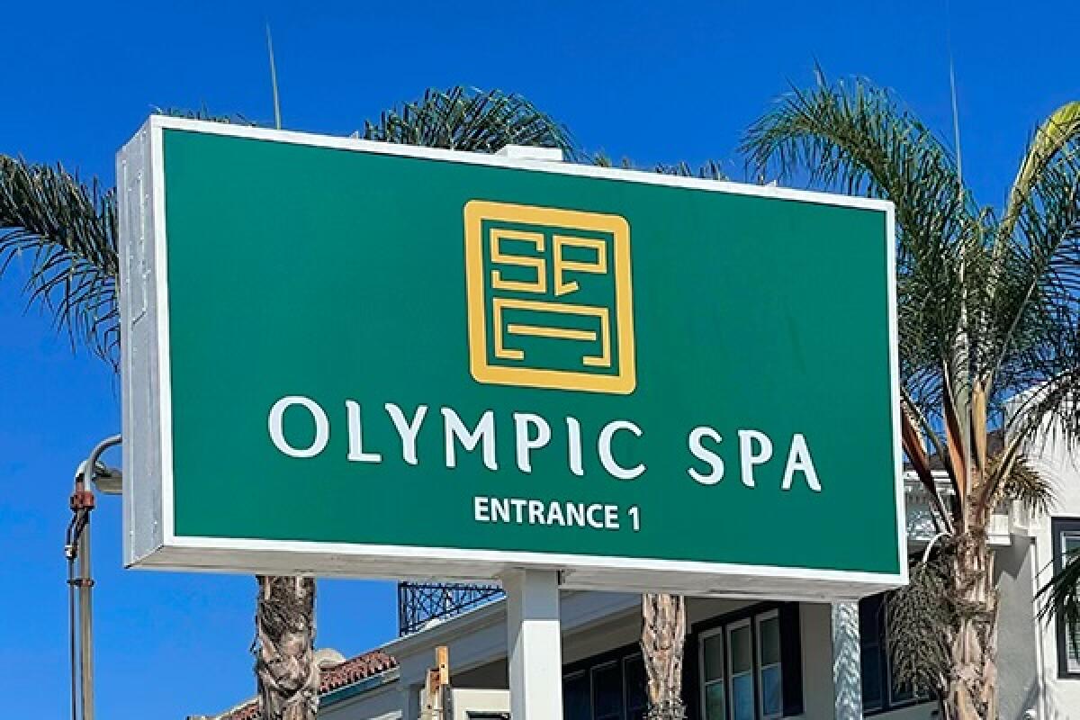 A rectangular green sign reads "Olympic Spa."