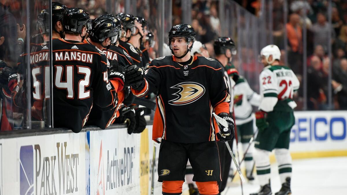 Ducks center Adam Henrique celebrates his goal with the bench during the third period against the Minnesota Wild, but the team fell to 0-3 in overtime.