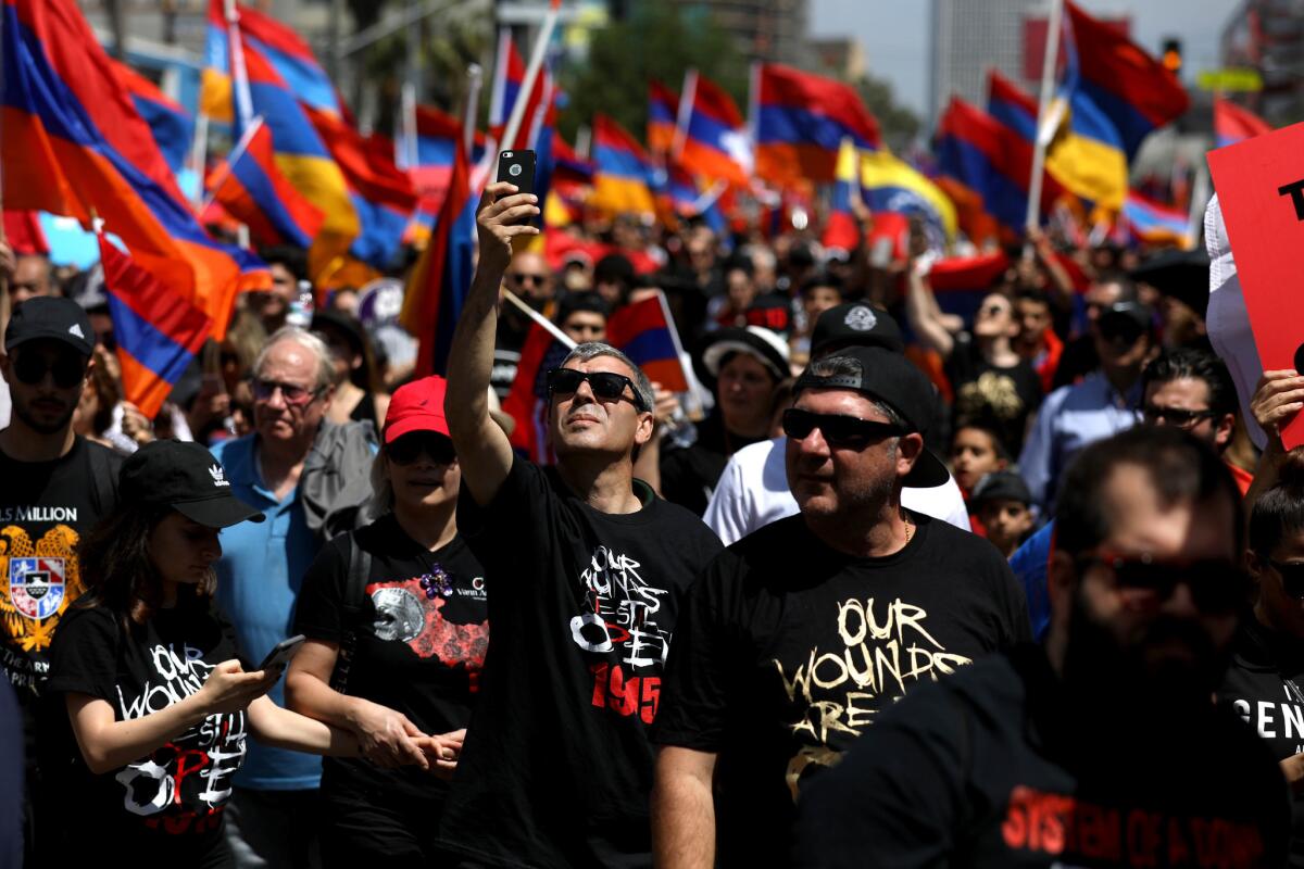 Demonstrators wave Armenian flags 
