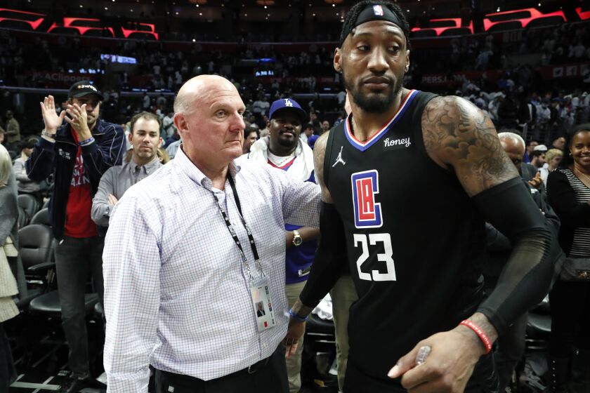 Los Angeles, CA, Friday, April 15, 2022 - LA Clippers owner Steve Ballmer consoles LA Clippers forward Robert Covington (23) after a 105-103 loss to the New Orleans Pelicans in the NBA Play-In tournament at Crypto.com Arena. (Robert Gauthier/Los Angeles Times)