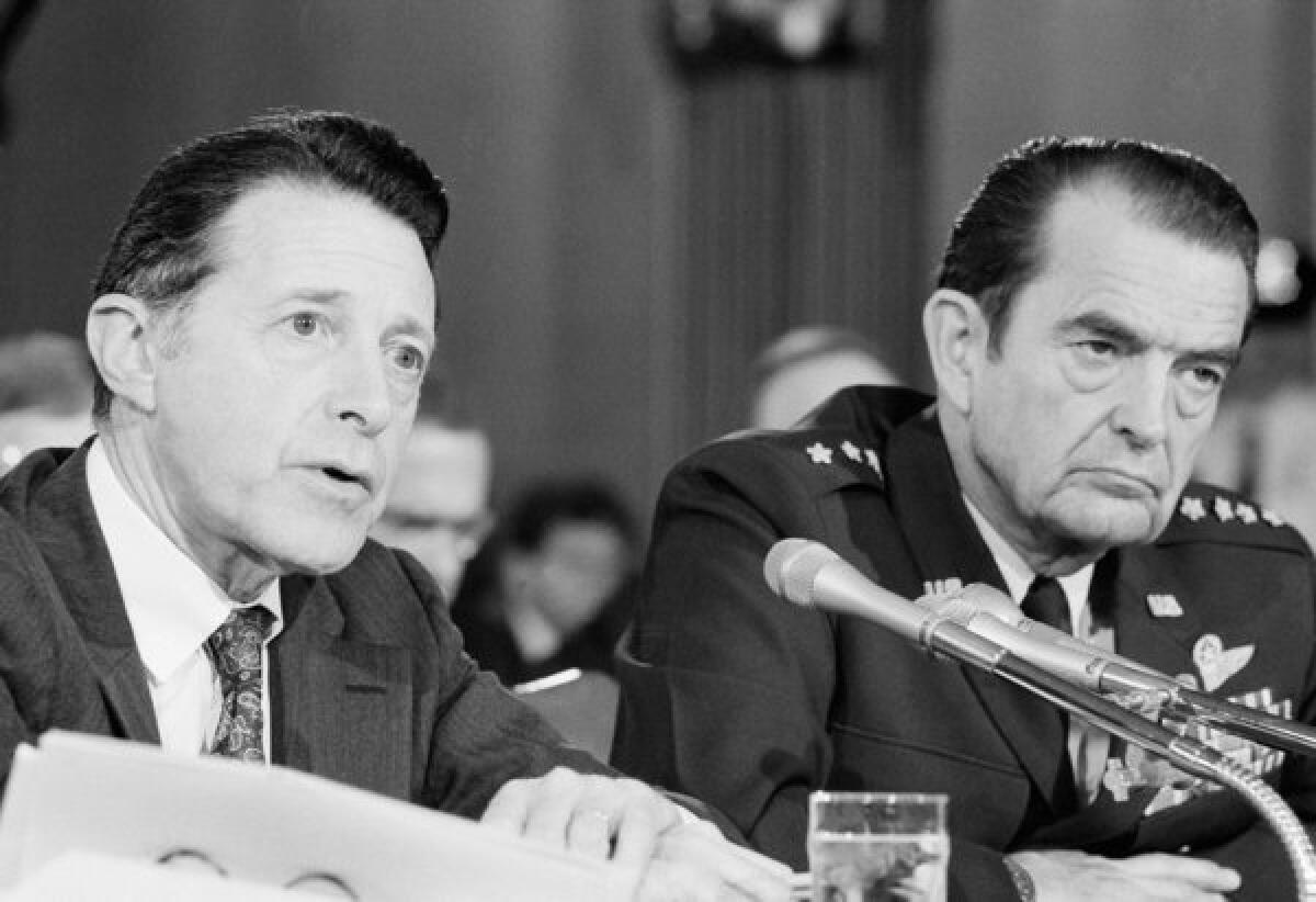 David C. Jones, right, shown with Defense Secretary Caspar Weinberger in 1981, recommended a sweeping reorganization of the nation's military command.