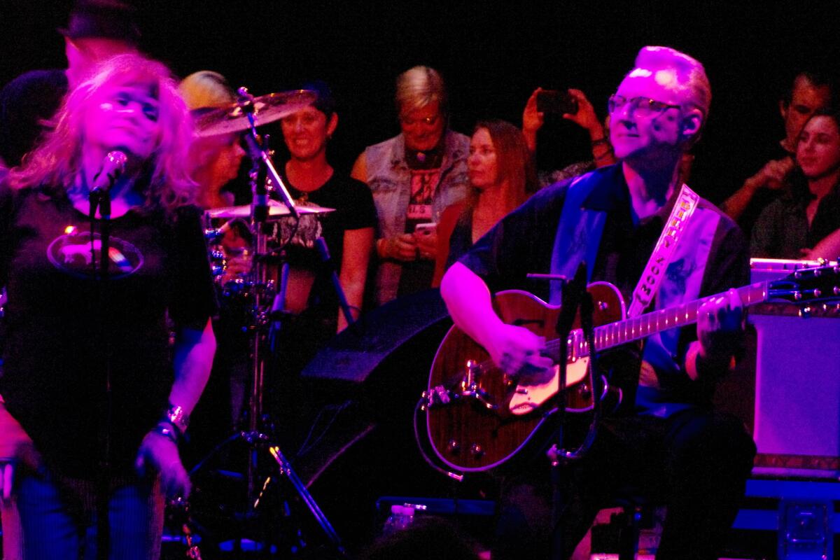 Singer Exene Cervenka, left, and guitarist Billy Zoom perform with L.A. punk band X on Friday, July 10, 2015, at the Observatory in Santa Ana, following news that Zoom will leave the band next week to begin treatment for bladder cancer.